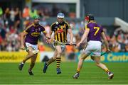 9 June 2018; TJ Reid of Kilkenny in action against Matthew O'Hanlon, left, and Diarmuid O'Keeffe of Wexford during the Leinster GAA Hurling Senior Championship Round 5 match between Kilkenny and Wexford at Nowlan Park in Kilkenny. Photo by Daire Brennan/Sportsfile