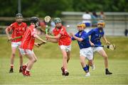 10 June 2018; Mark Field of Monaleen, co Limerick in action against Ken O'Mahony of  St Finbarrs, Co Cork, during the Division 1 Hurling shield semi-final between St Finbarrs, Co Cork and Monaleen, Co Limerick, at the John West Féile na nGael national competition which took place this weekend across Connacht, Westmeath and Longford. This is the third year that the Féile na nGael and Féile Peile na nÓg have been sponsored by John West, one of the world’s leading suppliers of fish. The competition gives up-and-coming GAA superstars the chance to participate and play in their respective Féile tournament, at a level which suits their age, skills and strengths. Photo by Matt Browne/Sportsfile