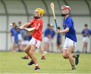 10 June 2018; Ben Murnane of Monaleen, Co Limerick, in action against Cian Buckley of St Finbarrs, Co Cork, during the Division 1 Hurling shield semi-final between St Finbarrs, Co Cork and Monaleen, Co Limerick, at the John West Féile na nGael national competition which took place this weekend across Connacht, Westmeath and Longford. This is the third year that the Féile na nGael and Féile Peile na nÓg have been sponsored by John West, one of the world’s leading suppliers of fish. The competition gives up-and-coming GAA superstars the chance to participate and play in their respective Féile tournament, at a level which suits their age, skills and strengths. Photo by Matt Browne/Sportsfile