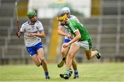 10 June 2018; Colin Coughlan of Limerick is tackled by Rory Furlong of Waterford during the Electric Ireland Munster GAA Hurling Minor Championship match between Limerick and Waterford at the Gaelic Grounds in Limerick. Photo by Ramsey Cardy/Sportsfile