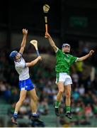 10 June 2018; Bryan Nix of Limerick in action against Gavin Fives of Waterford during the Electric Ireland Munster GAA Hurling Minor Championship match between Limerick and Waterford at the Gaelic Grounds in Limerick. Photo by Ramsey Cardy/Sportsfile