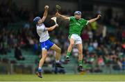 10 June 2018; Bryan Nix of Limerick in action against Gavin Fives of Waterford during the Electric Ireland Munster GAA Hurling Minor Championship match between Limerick and Waterford at the Gaelic Grounds in Limerick. Photo by Ramsey Cardy/Sportsfile