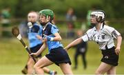 10 June 2018; Amy McCain of O'Moores, Co Laois, in action against Hannah Doyle of Castledawson, Co Derry, during the Division 4 Camogie semi-final between O'Moores, Co Laois, and Castledawson, Co Derry, at the John West Féile na nGael national competition which took place this weekend across Connacht, Westmeath and Longford. This is the third year that the Féile na nGael and Féile Peile na nÓg have been sponsored by John West, one of the world’s leading suppliers of fish. The competition gives up-and-coming GAA superstars the chance to participate and play in their respective Féile tournament, at a level which suits their age, skills and strengths. Photo by Matt Browne/Sportsfile