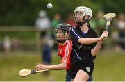 10 June 2018; Katlyn Sheehan of Sarsfields, Co Cork, in action against Ava Killian of Carnmore, Co Galway, during the Division 1 Camogie semi-final between Carnmore, Co Galway and Sarsfields, Co Cork, at the John West Féile na nGael national competition which took place this weekend across Connacht, Westmeath and Longford. This is the third year that the Féile na nGael and Féile Peile na nÓg have been sponsored by John West, one of the world’s leading suppliers of fish. The competition gives up-and-coming GAA superstars the chance to participate and play in their respective Féile tournament, at a level which suits their age, skills and strengths. Photo by Matt Browne/Sportsfile