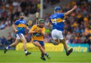 10 June 2018; John Conlon of Clare in action against Donagh Maher of Tipperary during the Electric Ireland Munster GAA Hurling Minor Championship match between Tipperary and Clare at Semple Stadium in Thurles, Tipperary. Photo by Ray McManus/Sportsfile