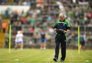 10 June 2018; Limerick manager John Kiely studies the programme prior to the Munster GAA Hurling Senior Championship Round 4 match between Limerick and Waterford at the Gaelic Grounds in Limerick. Photo by Eóin Noonan/Sportsfile