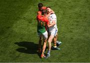 10 June 2018; Laois goalkeeper Graham Brody in a tussle with Daniel St Ledger, behind, and Seán Gannon of Carlow, for which St Ledger was shown the yellow card, during the Leinster GAA Football Senior Championship Semi-Final match between Carlow and Laois at Croke Park in Dublin. Photo by Piaras Ó Mídheach/Sportsfile