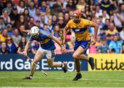 10 June 2018; Peter Duggan of Clare evades the tackle of Seán O'Brien of Tipperary on his way to scoring the match winning point during the Munster GAA Hurling Senior Championship Round 4 match between Tipperary and Clare at Semple Stadium in Thurles, Tipperary. Photo by David Fitzgerald/Sportsfile