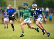 10 June 2018; Alex Burke of Emeralds, in action against Kilmaley, during the Division 3 Hurling semi-final between Emeralds, Co Kilkenny and Kilmaley, Co Clare, at the John West Féile na nGael national competition which took place this weekend across Connacht, Westmeath and Longford. This is the third year that the Féile na nGael and Féile Peile na nÓg have been sponsored by John West, one of the world’s leading suppliers of fish. The competition gives up-and-coming GAA superstars the chance to participate and play in their respective Féile tournament, at a level which suits their age, skills and strengths. Photo by Matt Browne/Sportsfile