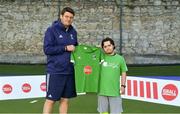 13 June 2018; The Irish ParaHockey ID team today announced Off The Ball as their shirt sponsor ahead of the European ParaHockey Tournament in Barcelona. ParaHockey ID and Irish Under 16 Coach Niall Denham presents Harry Gaw of Monkstown HC, Co. Dublin, with his jersey at the Three Rock Rovers HC, Grange Road in Rathfarnham, Dublin. Photo by Harry Murphy/Sportsfile