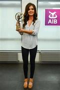 13 June 2018;  Amy Kennedy of Burgess-Duharra and Tipperary receives the AIB Camogie Provincial Club Player of The Year Award in Munster. Amy Kennedy was presented with the award by Sharon Finnegan, AIB Nenagh Branch Manager and Bridget Bourke, Chairperson of Tipperary Camogie Board in AIBâ€™s local branch on Wednesday, June 13th. Amy Kennedy was honoured for her performance, dedication, commitment and passion that she has shown through #TheToughest Camogie Club Championship season in 2017/18.AIB, proud sponsors of the Camogie Club Championship, announced a 5-year extension to their GAA sponsorship of Backing Club and County. The extension covers the AIB All-Ireland Camogie Club Championships which AIB have been title sponsor of since 2013 when it was added to their long-term association with the AIB GAA All-Ireland Club Championships  which commenced for the 1991/1992 season, as well as the All-Ireland Senior Football Championships that AIB have been involved with since 2015. For exclusive content and to see why AIB are backing Club and County follow us @AIB_GAA on Twitter, Instagram, Snapchat, Facebook and AIB.ie/GAA. Pictured is Amy Kennedy of Burgess-Duharra and Tipperary, with her award at AIB Nenagh Branch in Nenagh, Tipperary.  Photo by Sam Barnes/Sportsfile