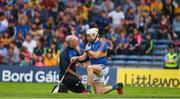 10 June 2018; Joe O'Dwyer of Tipperary is attended to by Phisio Paddy O'Brien during the Munster GAA Hurling Senior Championship Round 4 match between Tipperary and Clare at Semple Stadium in Thurles, Tipperary. Photo by Ray McManus/Sportsfile