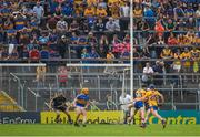 10 June 2018; Supporters of Tipperary and Clare look on as Ian Galvin, 23, of Clare shoots to score a late goal during the Munster GAA Hurling Senior Championship Round 4 match between Tipperary and Clare at Semple Stadium in Thurles, Tipperary. Photo by Ray McManus/Sportsfile