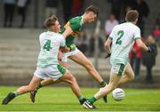 15 June 2018; David Shaw of Kerry scores his side's first goal despite the efforts of Adam Riordan, left, and Cillian Ferris of Limerick during the EirGrid Munster GAA Football U20 Championship quarter-final match between Limerick and Kerry in Newcastlewest, Co. Limerick. Photo by Diarmuid Greene/Sportsfile
