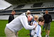 16 June 2018; Bord Gáis Energy Rewards Club winners attended the Bord Gáis Energy #HurlingToTheCore training camp in Páirc Uí Chaoimh today where they had the chance to meet hurling stars and Bord Gáis Energy ambassadors Alan Cadogan of Cork, Paudie Feehan of Tipperary and Fergal Whitely of Dublin. Pictured is former cork player Ger Cunningham signing autographs after the camp. All attendees were members of the Bord Gáis Energy Rewards Club, which offers its customers unmissable rewards throughout the Championship season, including match tickets and hospitality, access to training camps with Hurling stars and the opportunity to present Man of the Match Awards at U-21 games during the 2018 BGE #HurlingToTheCore training camp at Páirc Uí Chaoimh in Ballintemple, Cork. Photo by Eóin Noonan/Sportsfile