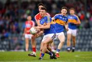16 June 2018; Colm O Callaghan of Cork is tackled by Liam Meagher of Tipperary during the EirGrid Munster GAA Football U20 Championship quarter-final match between Cork and Tipperary at Páirc UÍ Rinn, Cork. Photo by Eóin Noonan/Sportsfile