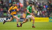 17 June 2018; Cormac Ryan of Limerick  in action against Jason Griffin of Clare during the Electric Ireland Munster GAA Hurling Minor Championship Round 5 match between Clare and Limerick at Cusack Park in Ennis, Clare. Photo by Ray McManus/Sportsfile