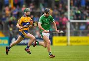 17 June 2018; Cormac Ryan of Limerick  in action against Jason Griffin of Clare during the Electric Ireland Munster GAA Hurling Minor Championship Round 5 match between Clare and Limerick at Cusack Park in Ennis, Clare. Photo by Ray McManus/Sportsfile