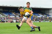 17 June 2018; Brian Derwin of Roscommon in action against John Cunnane of Mayo during the EirGrid Connacht GAA Football U20 Championship Final match between Mayo and Roscommon at Dr Hyde Park in Roscommon. Photo by Ramsey Cardy/Sportsfile