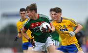17 June 2018; Brian O'Malley of Mayo in action against Dylan Ruane of Roscommon during the EirGrid Connacht GAA Football U20 Championship Final match between Mayo and Roscommon at Dr Hyde Park in Roscommon. Photo by Ramsey Cardy/Sportsfile