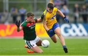 17 June 2018; Jordan Flynn of Mayo in action against Keith Murphy of Roscommon during the EirGrid Connacht GAA Football U20 Championship Final match between Mayo and Roscommon at Dr Hyde Park in Roscommon. Photo by Ramsey Cardy/Sportsfile