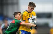 17 June 2018; Dylan Ruane of Roscommon is tackled by Oisín Mullin of Mayo during the EirGrid Connacht GAA Football U20 Championship Final match between Mayo and Roscommon at Dr Hyde Park in Roscommon. Photo by Ramsey Cardy/Sportsfile