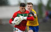 17 June 2018; Patrick O'Malley of Mayo is tackled by Ciarán Sugrue of Roscommon during the EirGrid Connacht GAA Football U20 Championship Final match between Mayo and Roscommon at Dr Hyde Park in Roscommon. Photo by Ramsey Cardy/Sportsfile