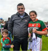 17 June 2018; Clara Barrett of Mayo holds the trophy with her father Collum Barrett, and brother Oscar Barrett, aged 5, after the All-Ireland Ladies Football U14 B Final between Mayo and Tipperary at Duggan Park in Ballinasloe, Co. Galway. Photo by Harry Murphy/Sportsfile