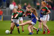 17 June 2018; Sara Finnane of Tipperary takes a shot under pressure from Laura Moran of Mayo during the All-Ireland Ladies Football U14 B Final between Mayo and Tipperary at Duggan Park in Ballinasloe, Co. Galway. Photo by Harry Murphy/Sportsfile