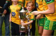 17 June 2018; Donegal supporter and niece of player Geraldine McLaughlin, Caoimhe McLaughlin, age 6, celebrates with the cup after the TG4 Ulster Ladies Football Senior Championship Final match between Armagh and Donegal at Brewster Park in Enniskillen, Co. Fermanagh. Photo by Daire Brennan/Sportsfile