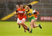 17 June 2018; Ann Marie McGlynn of Donegal in action against Tiarna Grimes of Armagh during the TG4 Ulster Ladies Football Senior Championship Final match between Armagh and Donegal at Brewster Park in Enniskillen, Co. Fermanagh. Photo by Daire Brennan/Sportsfile