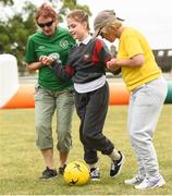 19 June 2018; Amelija Volavaite, age 9, with SNA's Ann Kelly, left, and Lisa Dowling during the visually impaired football training and match day at St Joseph's Primary School in Drumcondra, Dublin. Photo by David Fitzgerald/Sportsfile