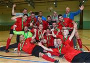 19 June 2018; Ian Byrne of Futsambas Naas holds the cup as his team-mates celebrate after the FAI Futsal Final match between Blue Magic and Futsambas Naas at Gormanstown College in Gormanstown, Co Meath. Photo by Matt Browne/Sportsfile