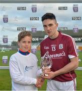 20 June 2018; Evan Niland of Galway is presented with the Bord Gáis Energy Man of the Match by Sean Fahy, aged 10, from Carnmore, Co. Galway, following the Bord Gáis Energy Leinster GAA Hurling U21 Championship Semi-Final match between Kilkenny and Galway. Bord Gáis Energy offers its customers unmissable rewards throughout the Championship season, including match tickets and hospitality, access to training camps with Hurling stars and the opportunity to present Man of the Match Awards at U-21 games. Bord Na Mona O'Connor Park, Tullamore, Co Offaly. Photo by Harry Murphy/Sportsfile
