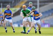 21 June 2018; Paddy Cadell of Tipperary in action against John Flynn of Limerick during the Bord Gais Energy Munster Under 21 Hurling Championship Semi-Final match between Tipperary and Limerick at Semple Stadium in Thurles, Tipperary. Photo by Eóin Noonan/Sportsfile