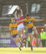 22 June 2018; Colm O'Callaghan of Cork in action against Tom Hannon, left, and Darragh Bohannon of Clare during the EirGrid Munster GAA Football U20 Championship semi-final match between Cork and Clare at Páirc Uí Rinn in Cork. Photo by Piaras Ó Mídheach/Sportsfile