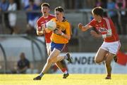 22 June 2018; Joe McGann of Clare in action against Tadhg Corkery, left, and Brian Murphy of Cork during the EirGrid Munster GAA Football U20 Championship semi-final match between Cork and Clare at Páirc Uí Rinn in Cork. Photo by Piaras Ó Mídheach/Sportsfile