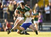 22 June 2018; Donal O'Sullivan of Kerry in action against Liam Cooney of Waterford during the EirGrid Munster GAA Football U20 Championship semi-final match between Kerry and Waterford at Austin Stack Park in Tralee, Kerry. Photo by Matt Browne/Sportsfile