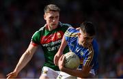 23 June 2018; Michael Quinlivan of Tipperary in action against Paddy Durcan of Mayo during the GAA Football All-Ireland Senior Championship Round 2 match between Tipperary and Mayo at Semple Stadium in Thurles, Tipperary. Photo by Ray McManus/Sportsfile