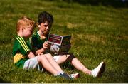 23 June 2018; Kerry supporters Adam, age 9, and Scott O'Day, age 5, left, from Glounthaune, Cork, read the match programme prior to the Munster GAA Football Senior Championship Final match between Cork and Kerry at Páirc Ui Chaoimh in Cork. Photo by Eóin Noonan/Sportsfile