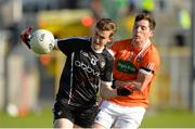 23 June 2018; Kyle Cawley of Sligo in action against Patrick Burns of Armagh during the GAA Football All-Ireland Senior Championship Round 2 match between Sligo and Armagh at Markievicz Park in Sligo. Photo by Oliver McVeigh/Sportsfile