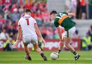 23 June 2018; Paul Geaney of Kerry scoring his side's third goal despite the efforts of Mark White of Cork during the Munster GAA Football Senior Championship Final match between Cork and Kerry at Páirc Ui Chaoimh in Cork. Photo by Eóin Noonan/Sportsfile