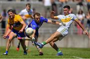 24 June 2018; Ruairí McNamee of Offaly scores a point under pressure from Robert Eyres of Clare during the GAA Football All-Ireland Senior Championship Round 2 match between Offaly and Clare at Bord Na Mona O’Connor Park in Tullamore, Offaly. Photo by Harry Murphy/Sportsfile