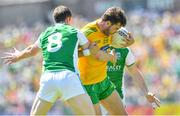 24 June 2018; Odhran MacNiallais of Donegal is tackled by Eoin Donnelly of Fermanagh during the Ulster GAA Football Senior Championship Final match between Donegal and Fermanagh at St Tiernach's Park in Clones, Monaghan. Photo by Ramsey Cardy/Sportsfile