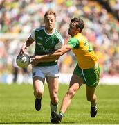 24 June 2018; Lee Cullen of Fermanagh in action against /Odhran MacNiallais of Donegal during the Ulster GAA Football Senior Championship Final match between Donegal and Fermanagh at St Tiernach's Park in Clones, Monaghan. Photo by Oliver McVeigh/Sportsfile