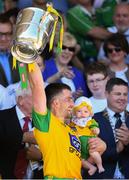 24 June 2018; Paddy McGrath of Donegal with his daughter Isla Rose lifts the trophy following the Ulster GAA Football Senior Championship Final match between Donegal and Fermanagh at St Tiernach's Park in Clones, Monaghan. Photo by Ramsey Cardy/Sportsfile