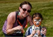 24 June 2018; Claire Kinsella with her daughter Aisling, age 4, from Garristown, after competing in the Irish Runner 5 Mile at the Phoenix Park in Dublin. Photo by Piaras Ó Mídheach/Sportsfile