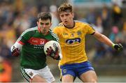 17 June 2018; Ross Egan of Mayo in action against Luke Mollahan of Roscommon during the EirGrid Connacht GAA Football U20 Championship Final match between Mayo and Roscommon at Dr Hyde Park in Roscommon. Photo by Piaras Ó Mídheach/Sportsfile