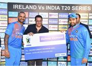 27 June 2018; Shikhar Dhawan, left, and Rohit Sharma of India are presented with the Maximum Sixes award by Navneen Sharma, TCM, following the T20 International match between Ireland and India at Malahide Cricket Club Ground in Dublin. Photo by Seb Daly/Sportsfile