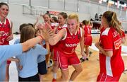 27 June 2018; Emma Hergot of Norway celebrates with children from Scartleigh National School, Saleen, Midleton, Co. Cork, after the FIBA 2018 Women's European Championships for Small Nations Group B match between Cyprus and Norway at the Mardyke Arena in Cork, Ireland. Photo by Brendan Moran/Sportsfile